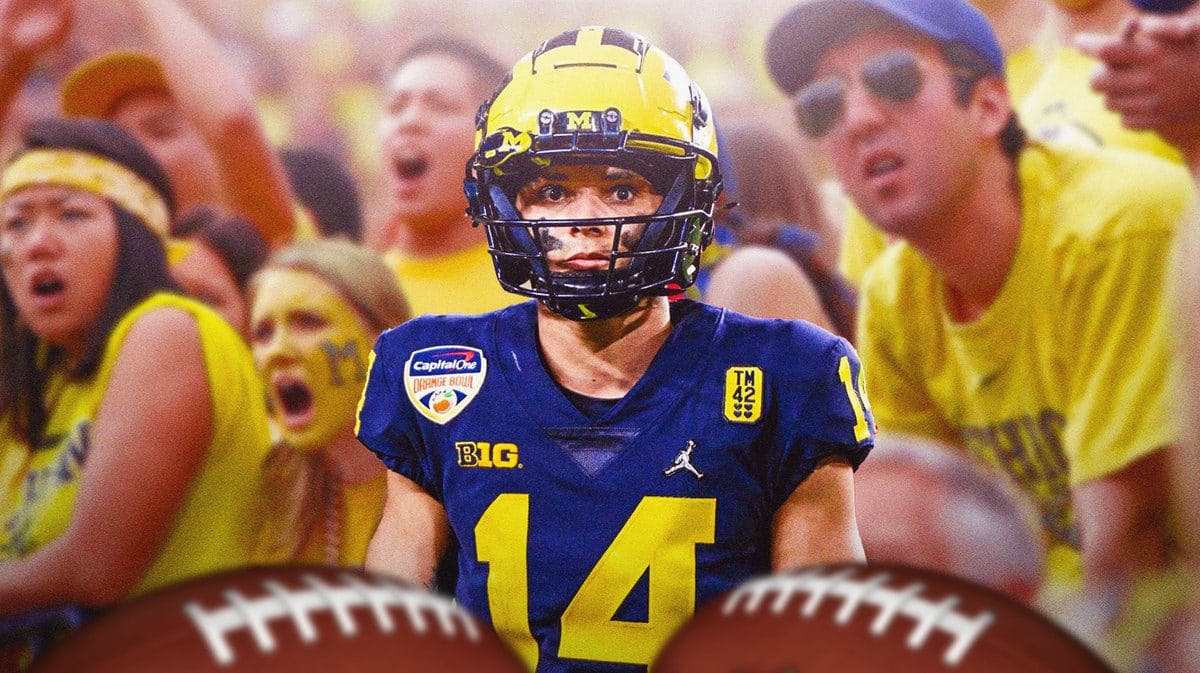 Roman Wilson with angry Michigan Wolverines fans in the background