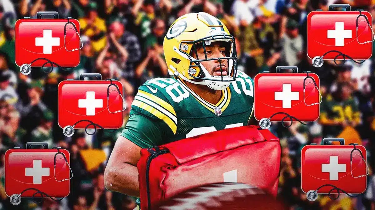 Photo: AJ Dillon in Packers uniform with med kits around him and fans in the back