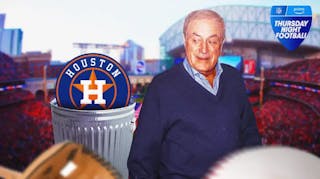Al Michaels next to an Houston Astros trash can