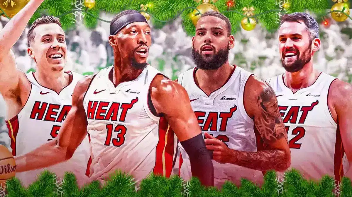 Miami Heat's Bam Adebayo, Kevin Love, Duncan Robinson, and Caleb Martin around Christmas decorations in front of the Kaseya Center.
