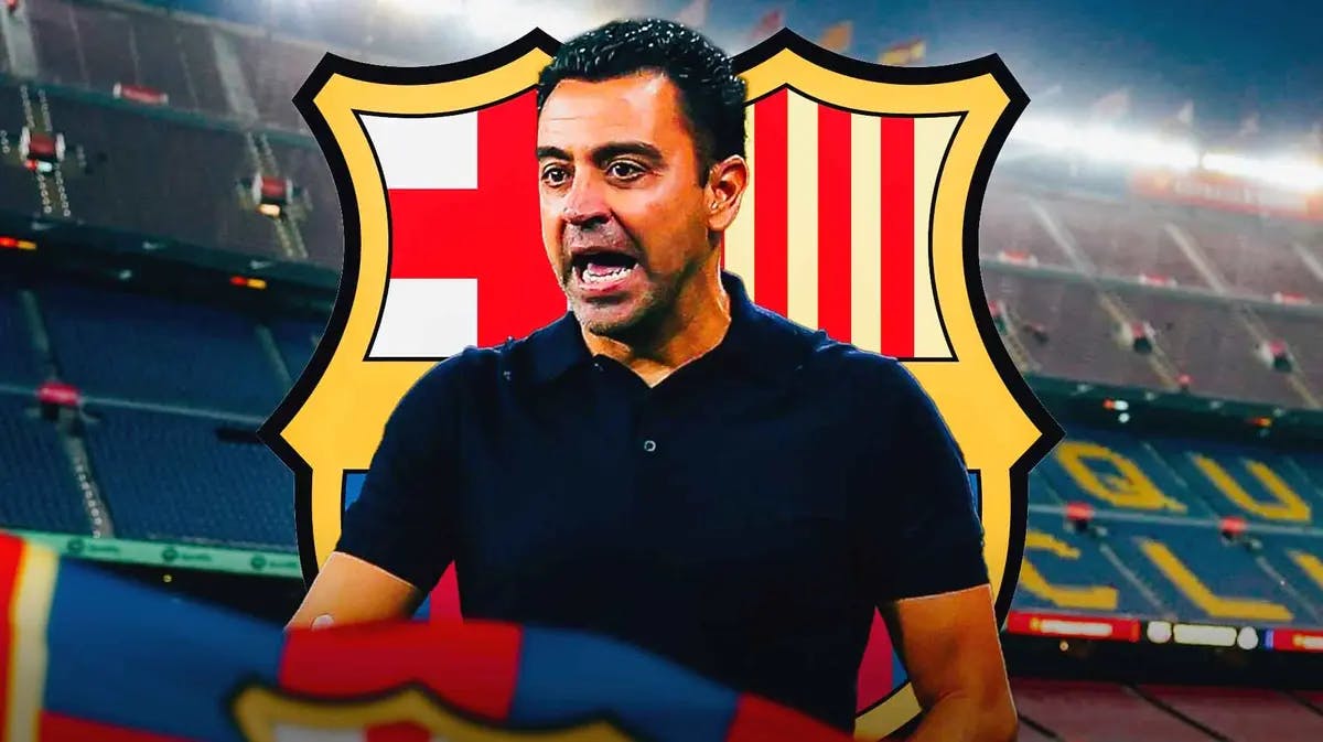 Xavi Hernandez shouting in front of the Barcelona logo