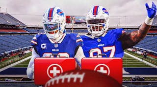 Photo: Micah Hyde and Jordan Phillips in Bills jerseys with medical kits around them