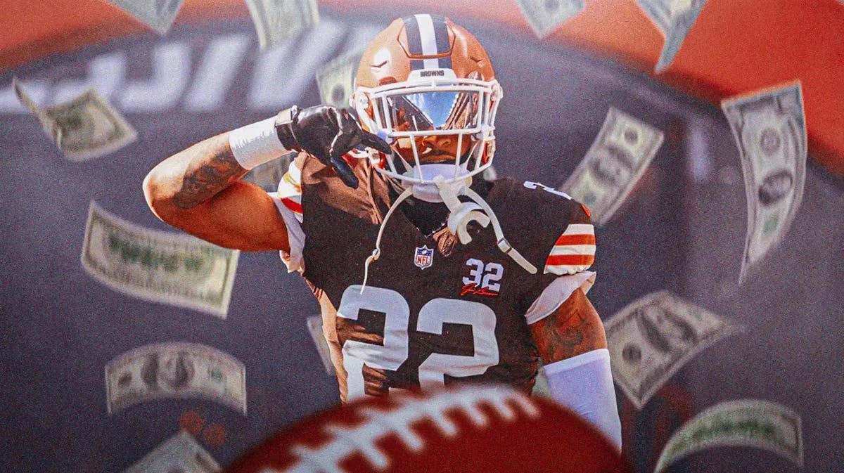 Browns safety Grant Delpit with money all around him.