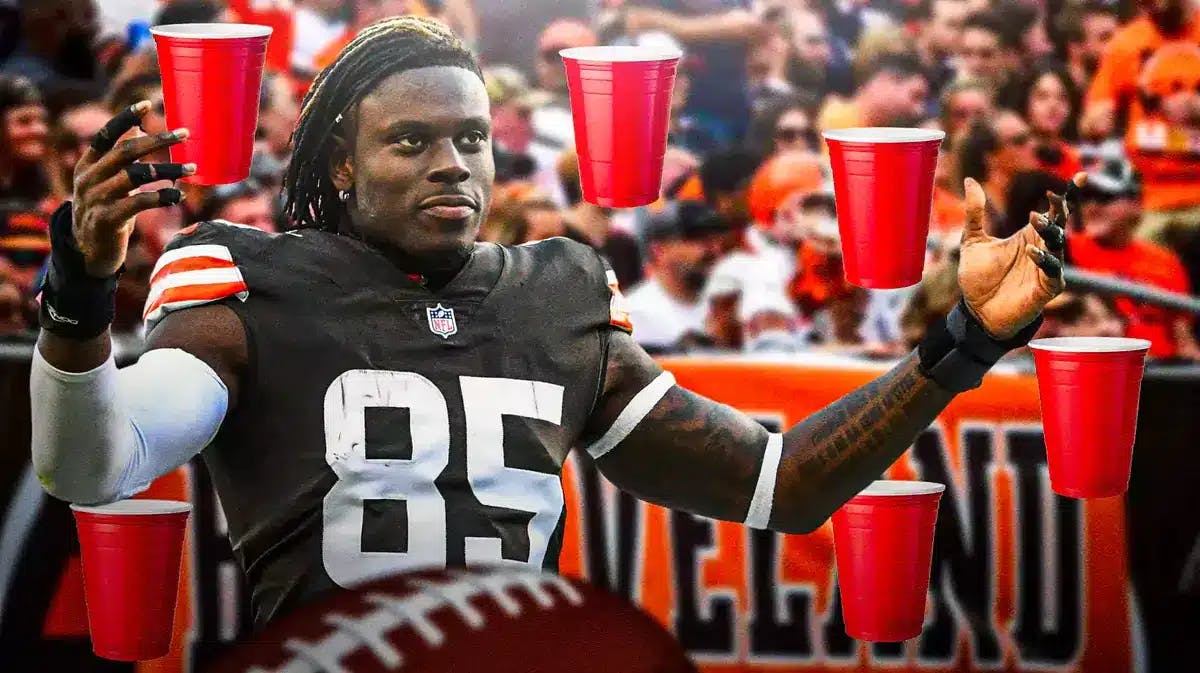Cleveland Browns tight end David Njoku with the Dawg Pound behind him and red solo cups around him