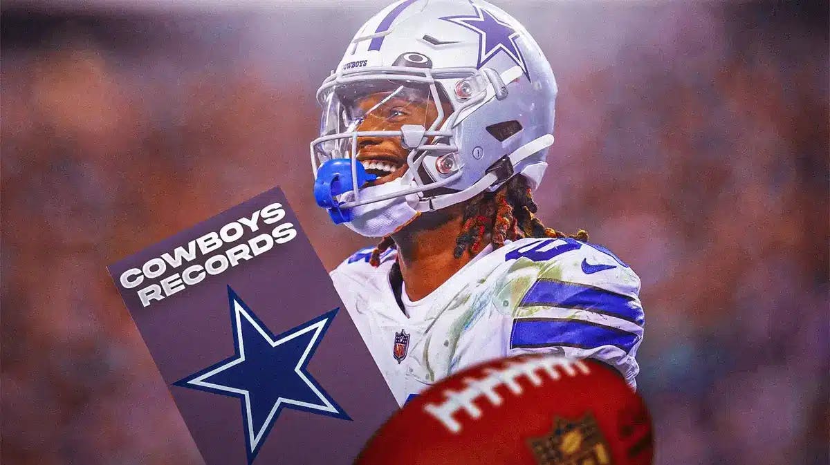 Cowboys' CeeDee Lamb holding the franchise record book