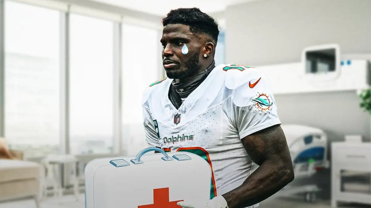 Tyreek Hill with animated tears while holding first-aid kit