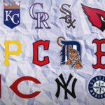 MLB Draft Lottery logo in the middle. Logos of Athletics, Royals, Rockies, White Sox, Cardinals, Angels, Mets, Pirates, Guardians, Tigers, Red Sox, Giants, Padres, Reds, Yankees, Mariners, Cubs all around the graphic.