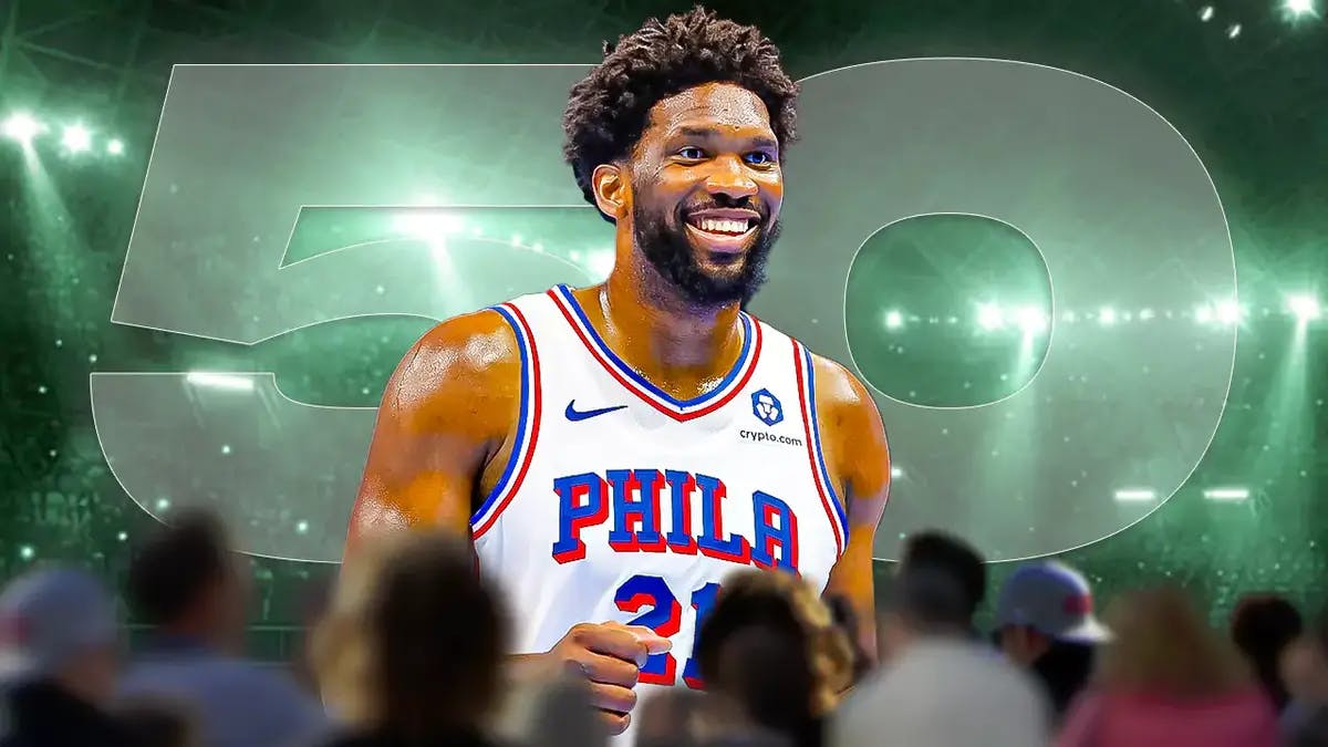 Sixers' Joel Embiid standing in front of the number 50