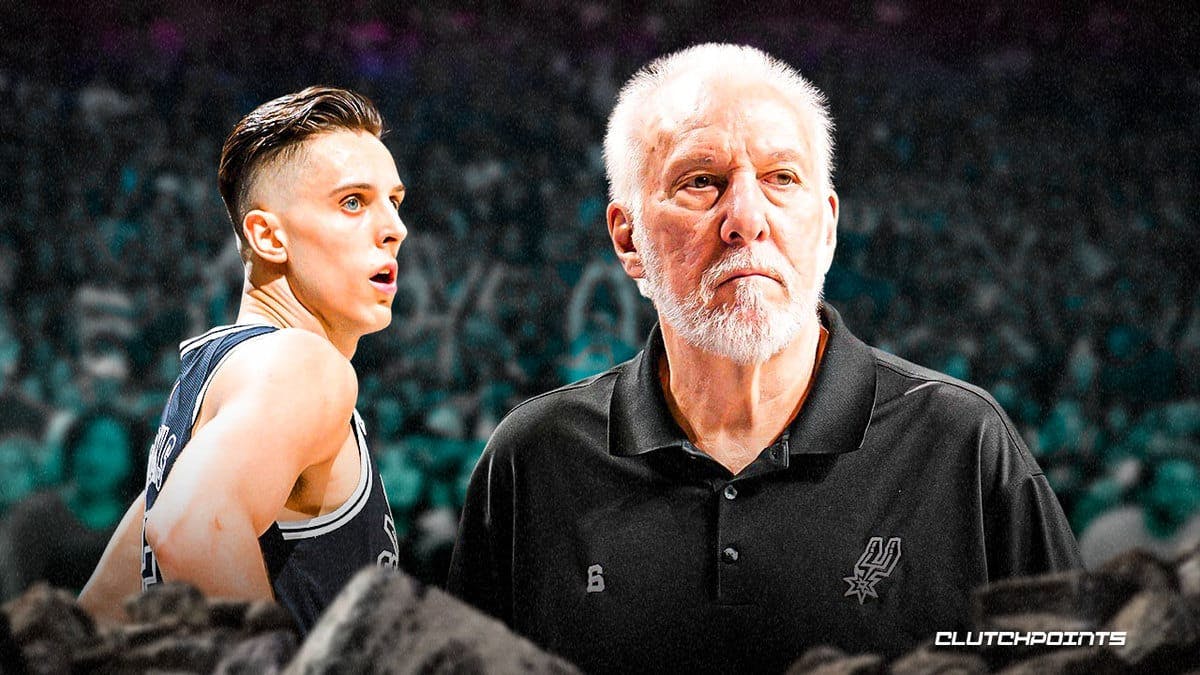 Zach Collins and Spurs coach Gregg Popovich looking serious