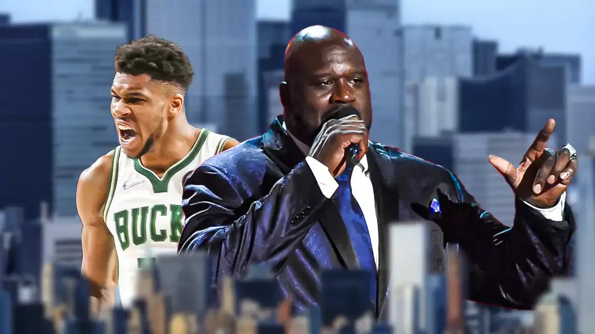 Shaquille O'Neal holding a microphone with angry Giannis Antetokounmpo at the back
