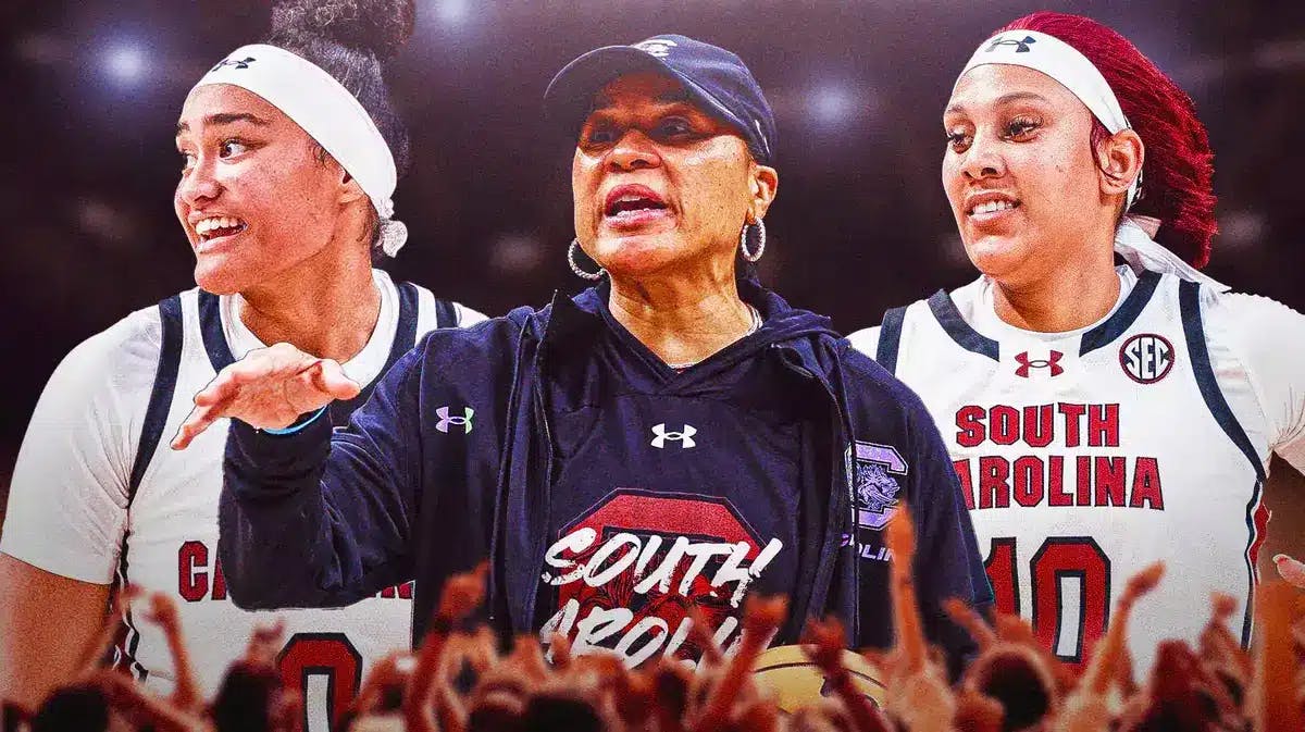 South Carolina women’s basketball coach Dawn Staley in the center, with other South Carolina women’s basketball players around Staley.