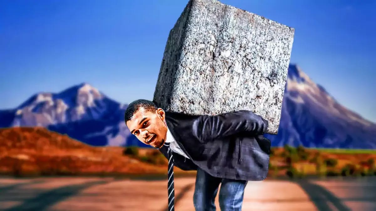 Victor Wembanyama carrying a big boulder of rock on his back