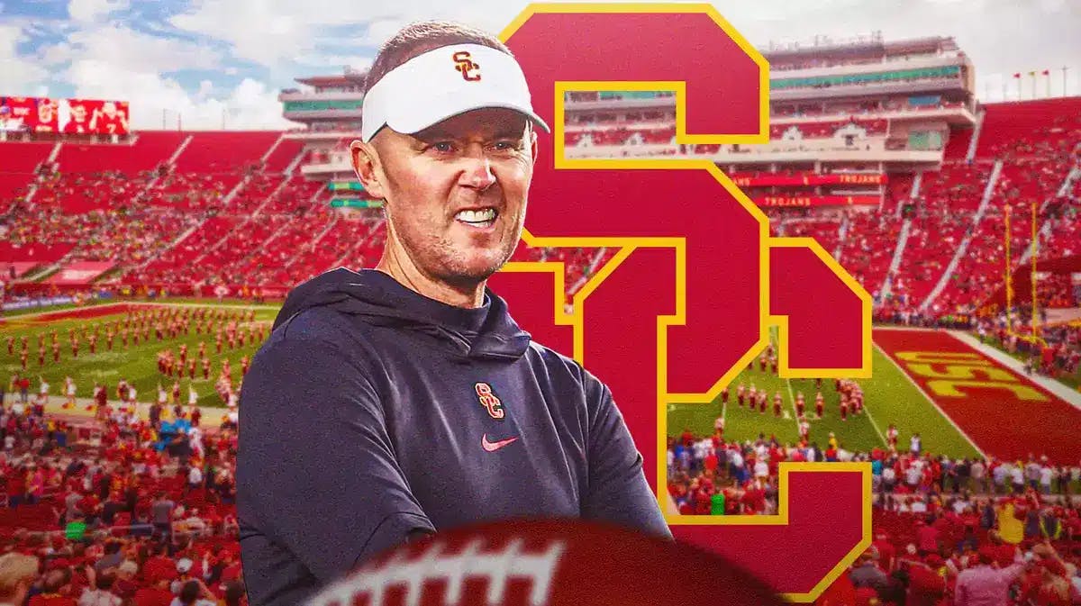 Photo: Lincoln Riley in USC gear with USC logo in the background