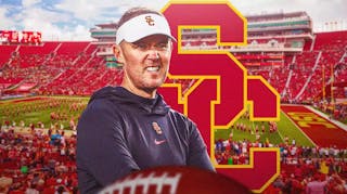 Photo: Lincoln Riley in USC gear with USC logo in the background