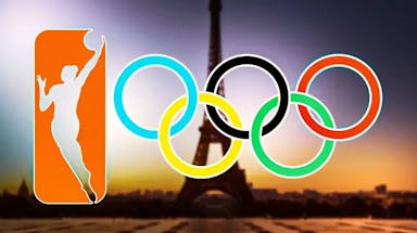The WNBA logo and the Olympic rings, with Paris and the Eiffel tower in the background