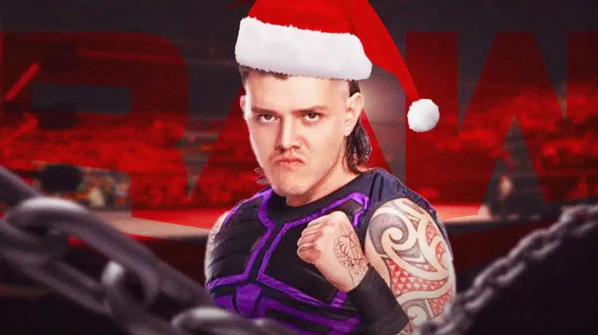 Dominik Mysterio with a Santa Claus hat on with the RAW logo as the background.