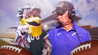 Air Force football coach Troy Calhoun looking at Tulane mascot.