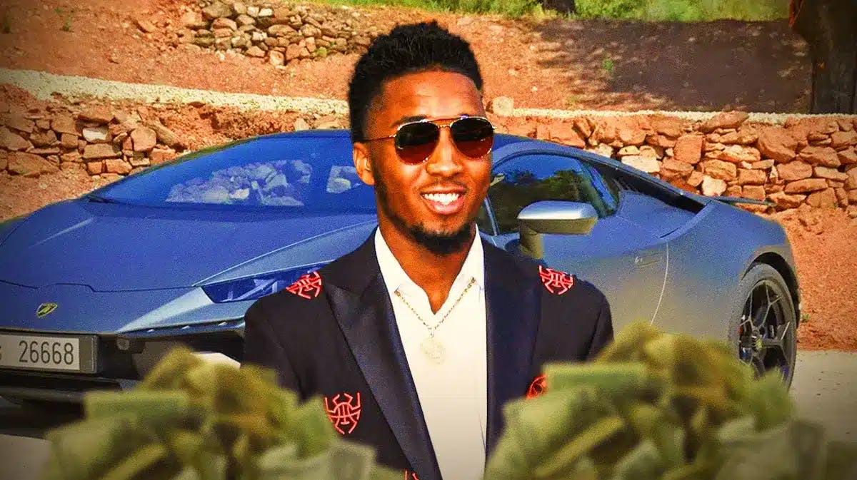 Donovan Mitchell in front of a car from his collection.