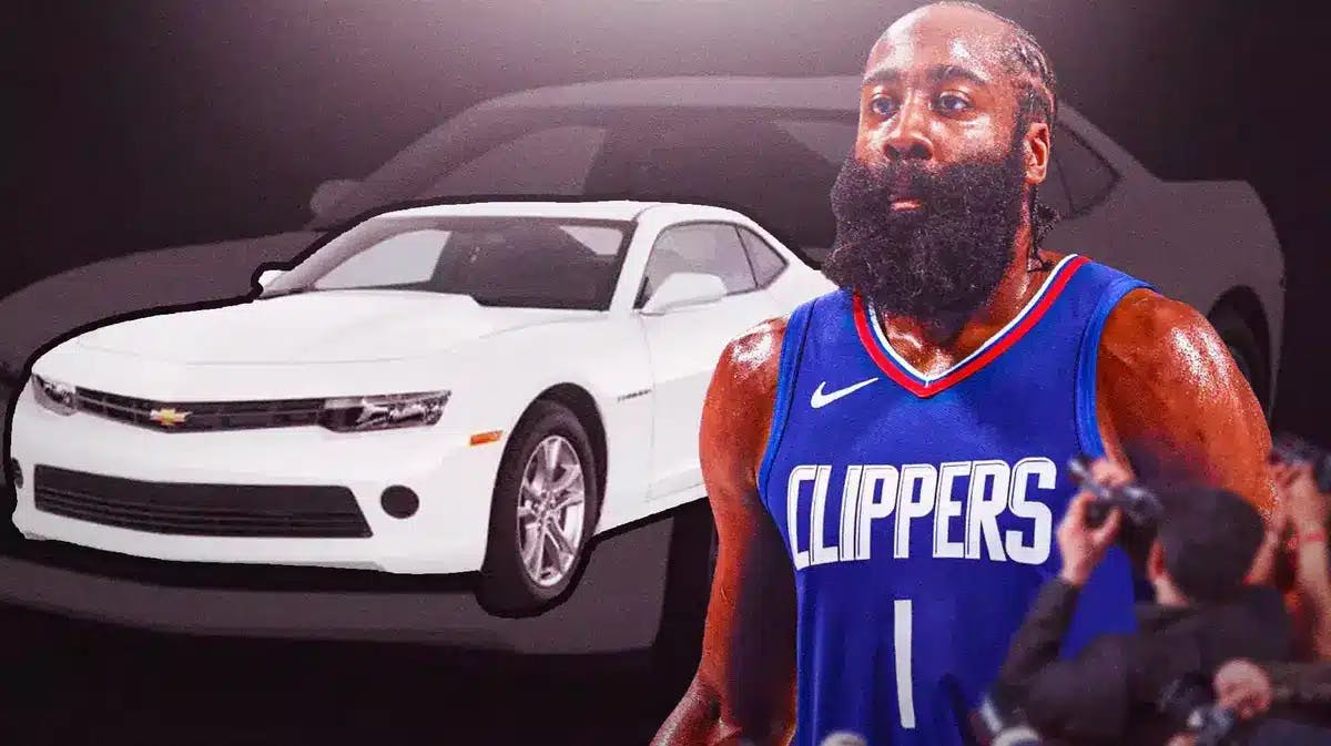 Jamers Harden in front of a car from his collection.