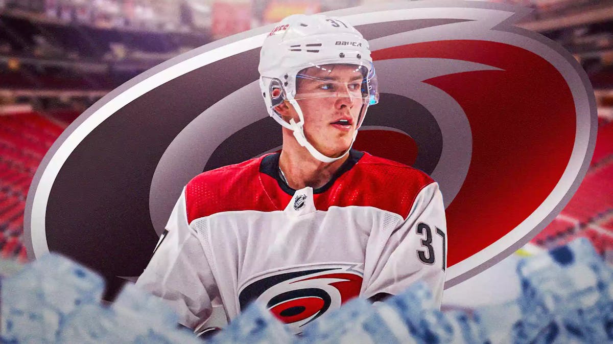 Hurricanes, Flames, Andrei Svechnikov, Andrei Svechnikov injury, Andrei Svechnikov Hurricanes, Andrei Svechnikov in Hurricanes uni with Hurricanes arena in the background