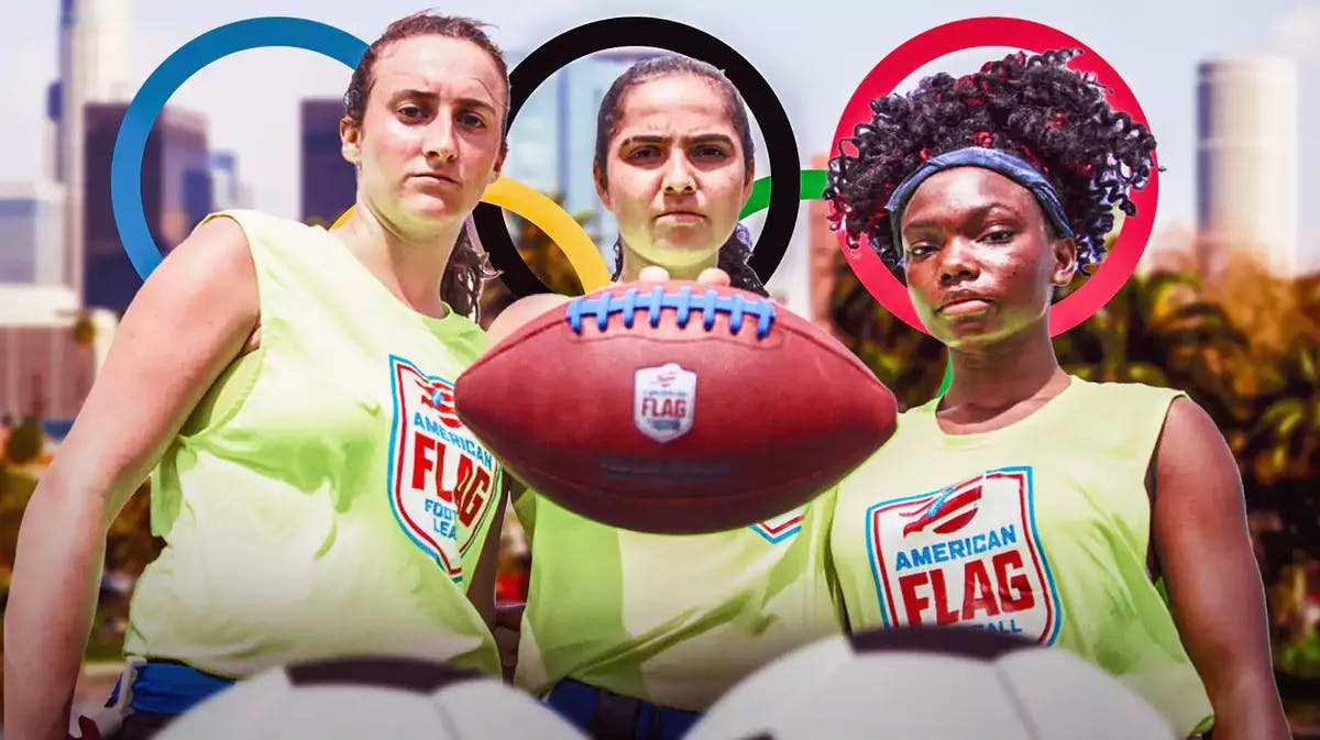 Players from the U.S. women’s flag football team with Olympic rings and the city of Los Angeles in the background
