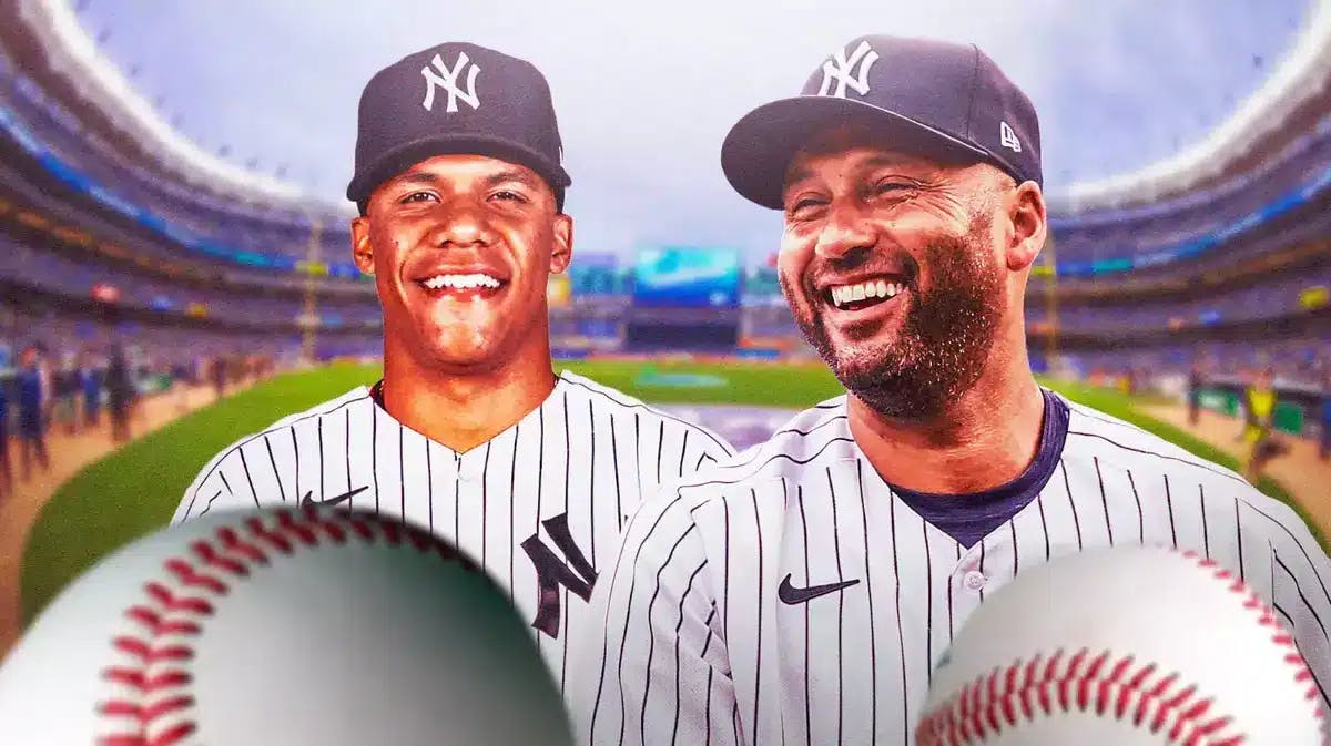 Derek Jeter smiling next to Juan Soto in a Yankees uniform at Yankee Stadium.