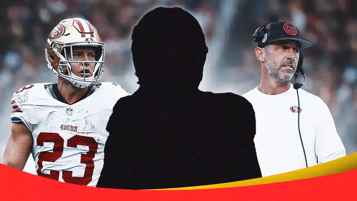 Mystery player in the middle, Christian McCaffrey and Coach Kyle Shanahan around him, and San Francisco 49ers wallpaper in the background.