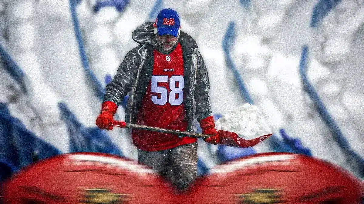 A Buffalo Bills fan shoveling snow at Highmark Stadium