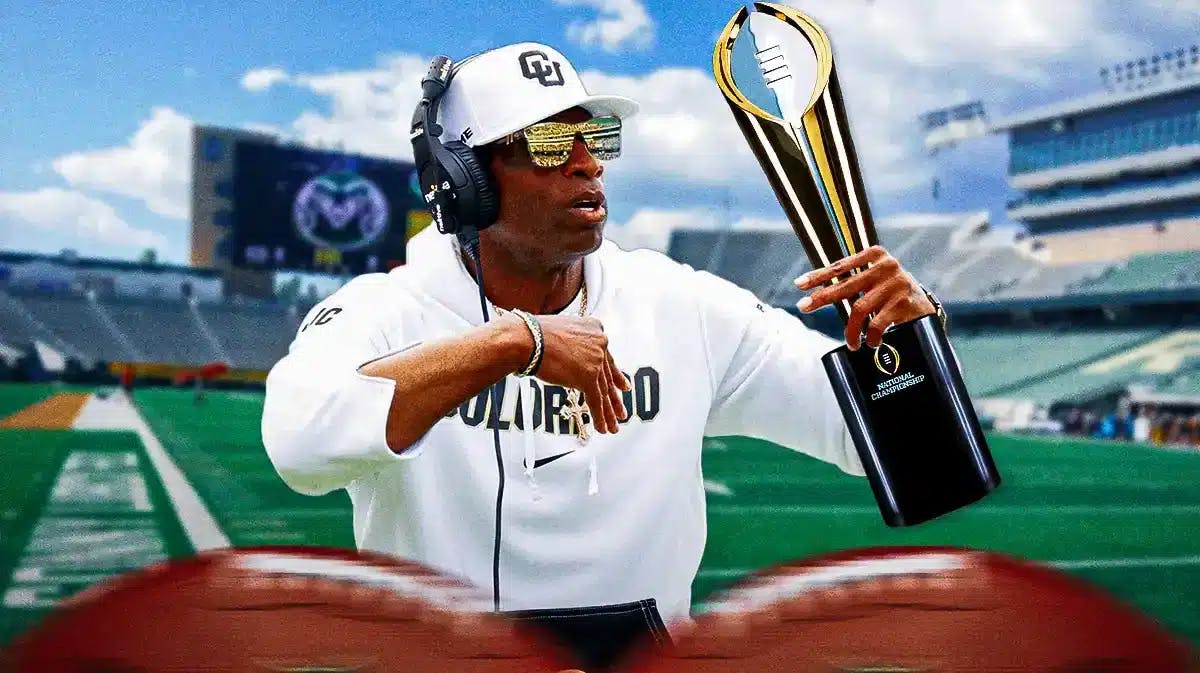 Colorado football coach Deion Sanders holding the College Football Playoff trophy