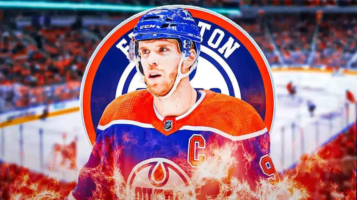 Connor McDavid in middle with fire all around him looking happy, EDM Oilers logo, hockey rink in background