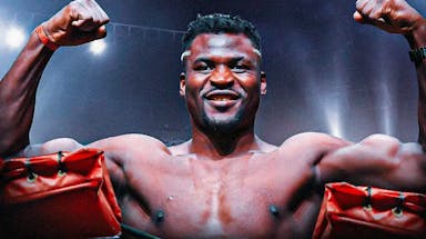 Francis Ngannou smiling in a boxing ring
