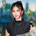 Gemma Chan surrounded by piles of cash.