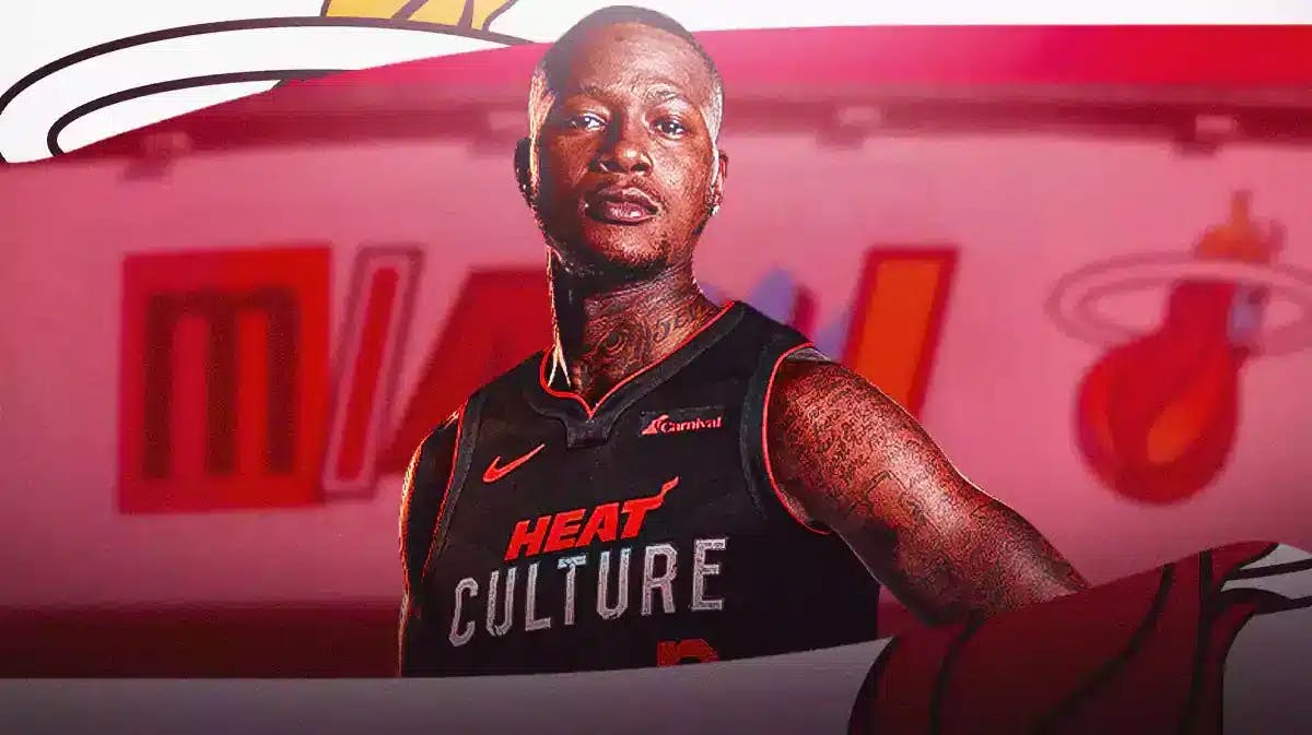New Miami Heat star Terry Rozier in front of the logo of the team in his new uniform.