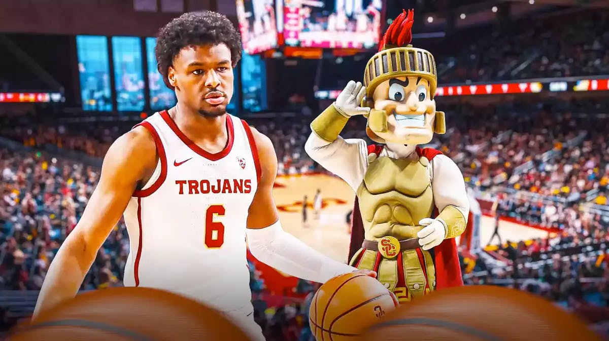 USC basketball’s Bronny James ACTION SHOT (shooting, passing, etc) with the USC basketball mascot in the background
