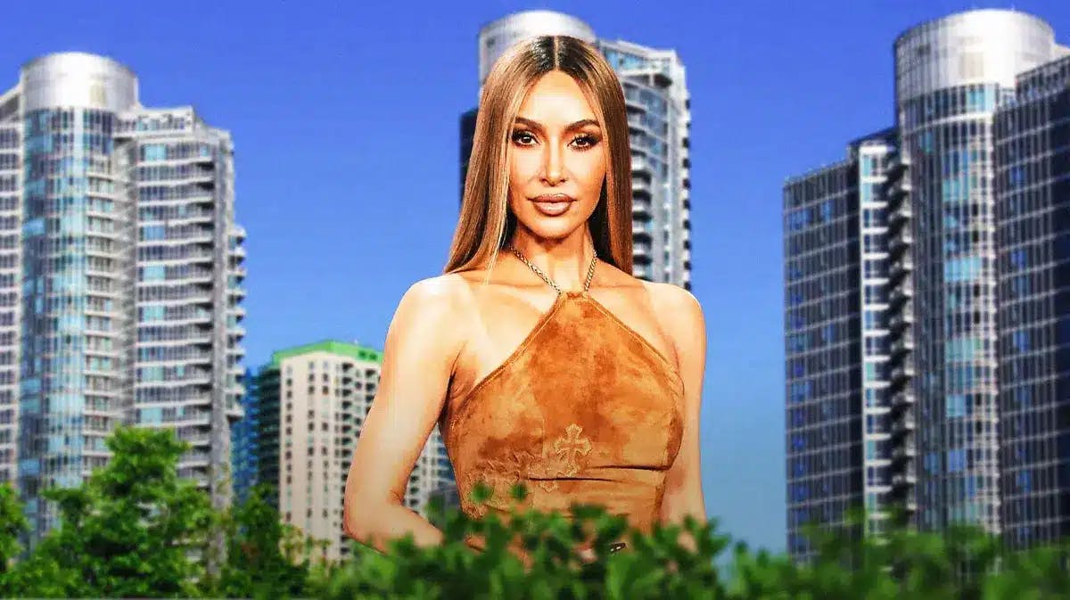 Kim Kardashian with a building behind her