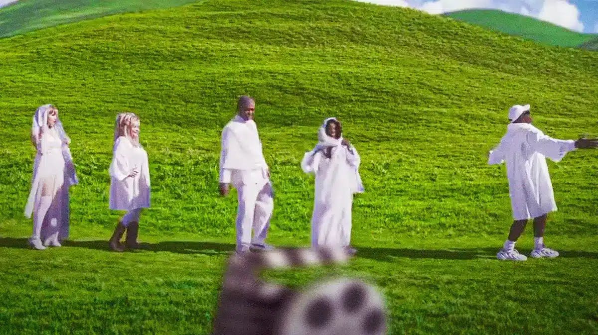 A still from the teaser trailer for Lil Nas X's new music video 'J Christ' with impersonators for Kanye West, Oprah, Barack Obama, Dolly Parton and Taylor Swift all parading through a grass field