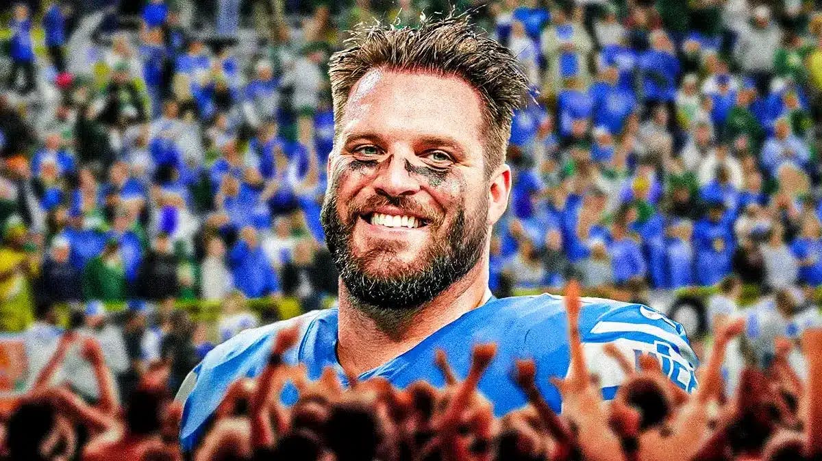 Taylor Decker smiling with Detroit Lions fans cheering