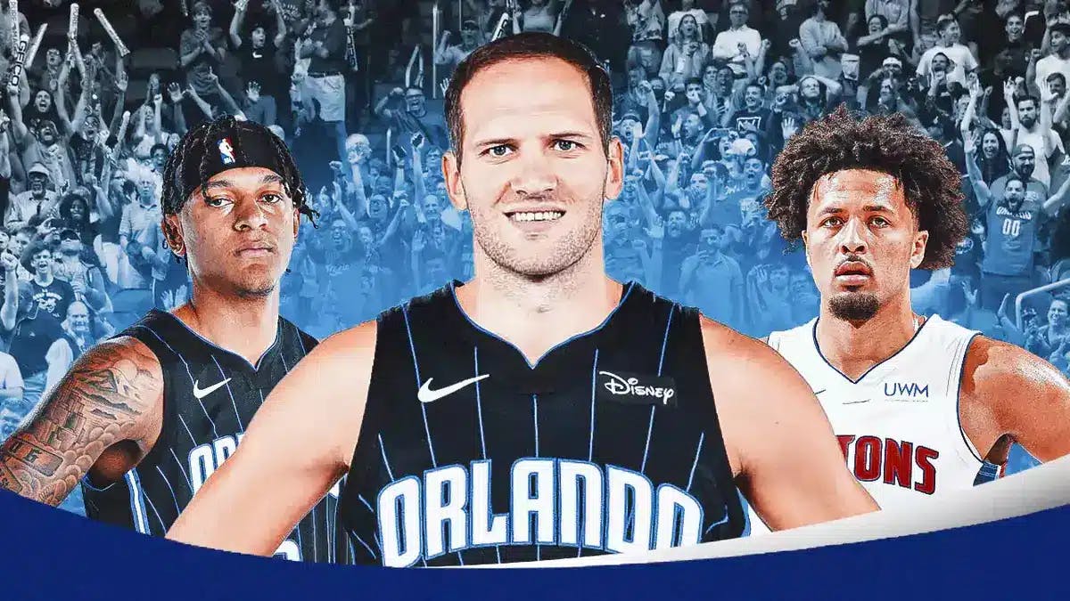 Bojan Bogdanovic in a Magic uni, with Paolo Banchero and Pistons' Cade Cunningham looking on
