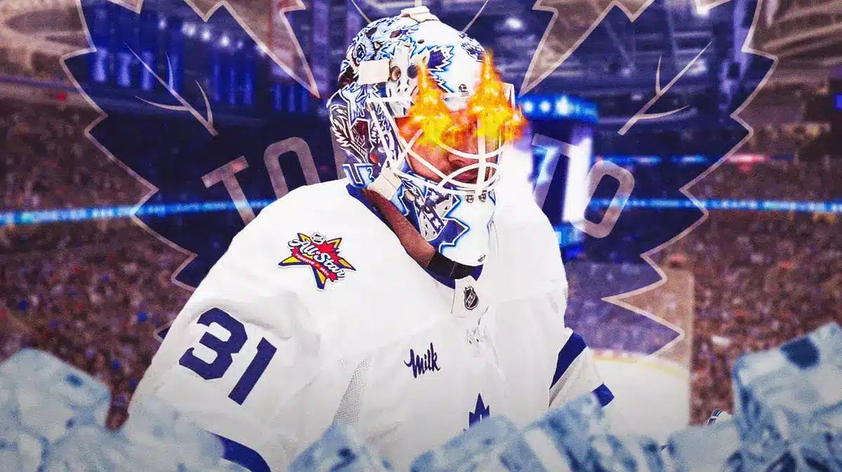 Toronto Maple Leafs goalie Martin Jones with fire in his eyes. Maple Leafs logo behind him and Maple Leafs' home rink as the background image