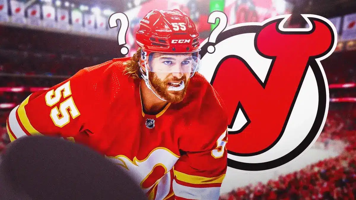 Noah Hanifin (Calgary Flames) next to the New Jersey Devils logo