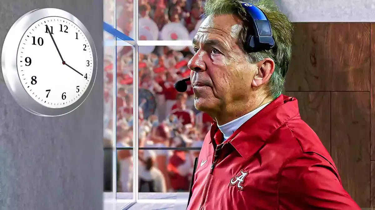 Alabama football coach Nick Saban stares at a clock