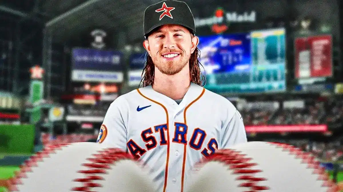 Josh Hader standing in a stadium smiling with an Astros jersey on