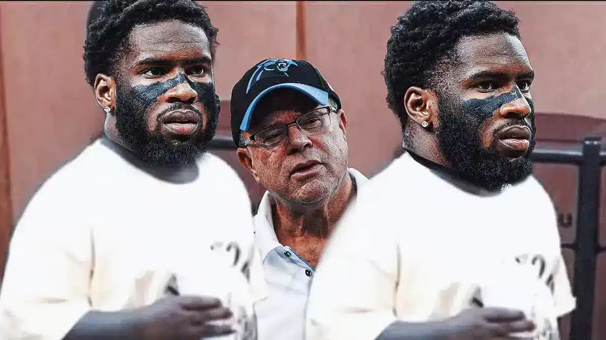 Panthers' Brian Burns in the pretend to not see meme, with David Tepper beside him