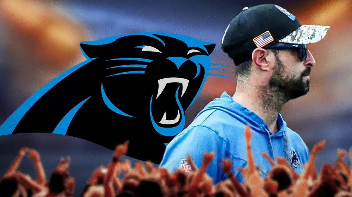 Carolina Panthers logo on left, on the right Lions COO Mike Disner turned his back.