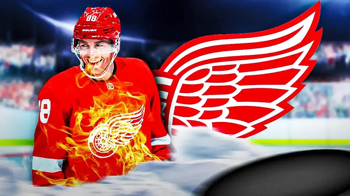 Patrick Kane in middle of image looking happy, fire around him, DET Red Wings logo, hockey rink in background