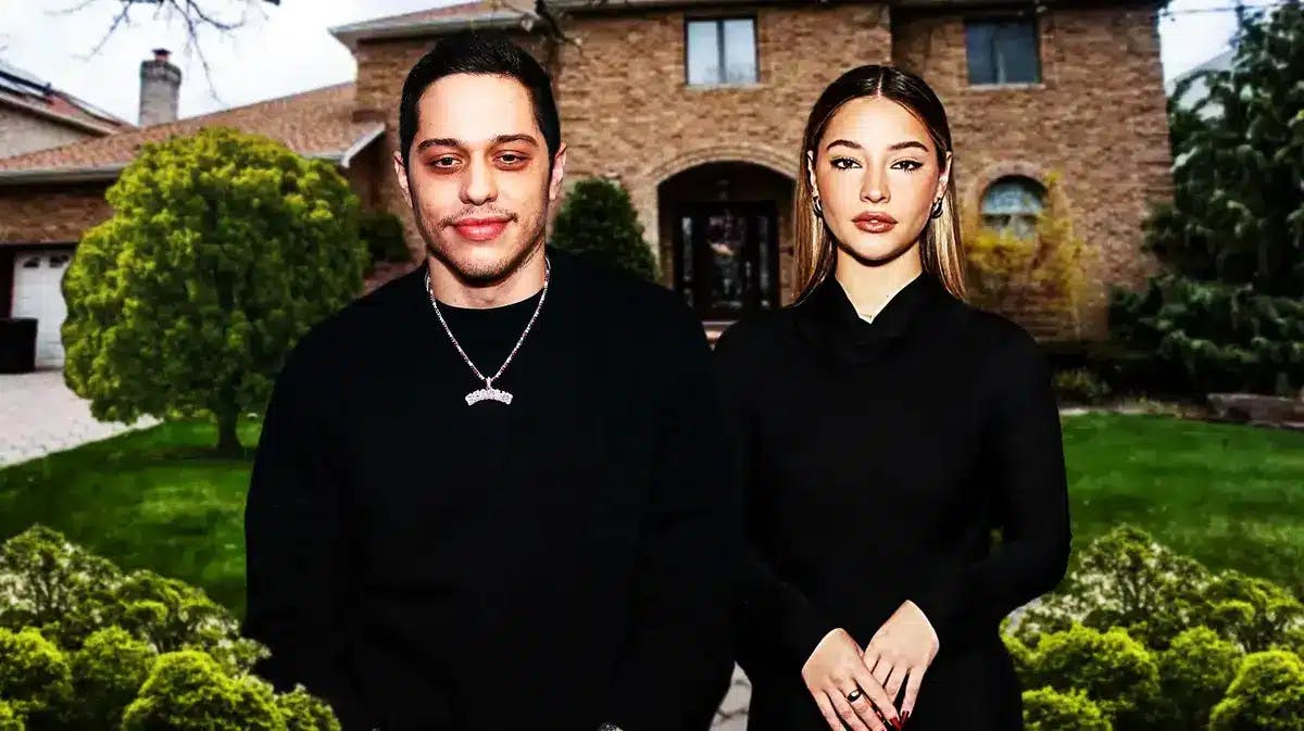 Pete Davidson and Madelyn Cline with a house behind them
