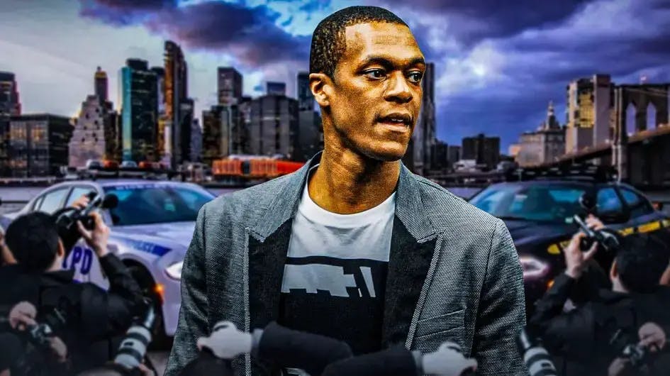 Rajon Rondo looking serious with police car in the background