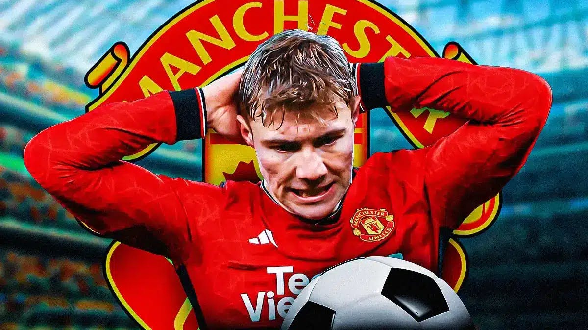 Rasmus Hojlund annoyed in front of the Manchester United logo