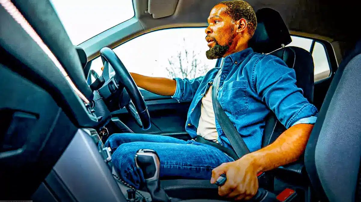 Suns' Kevin Durant holding on a car handbrake