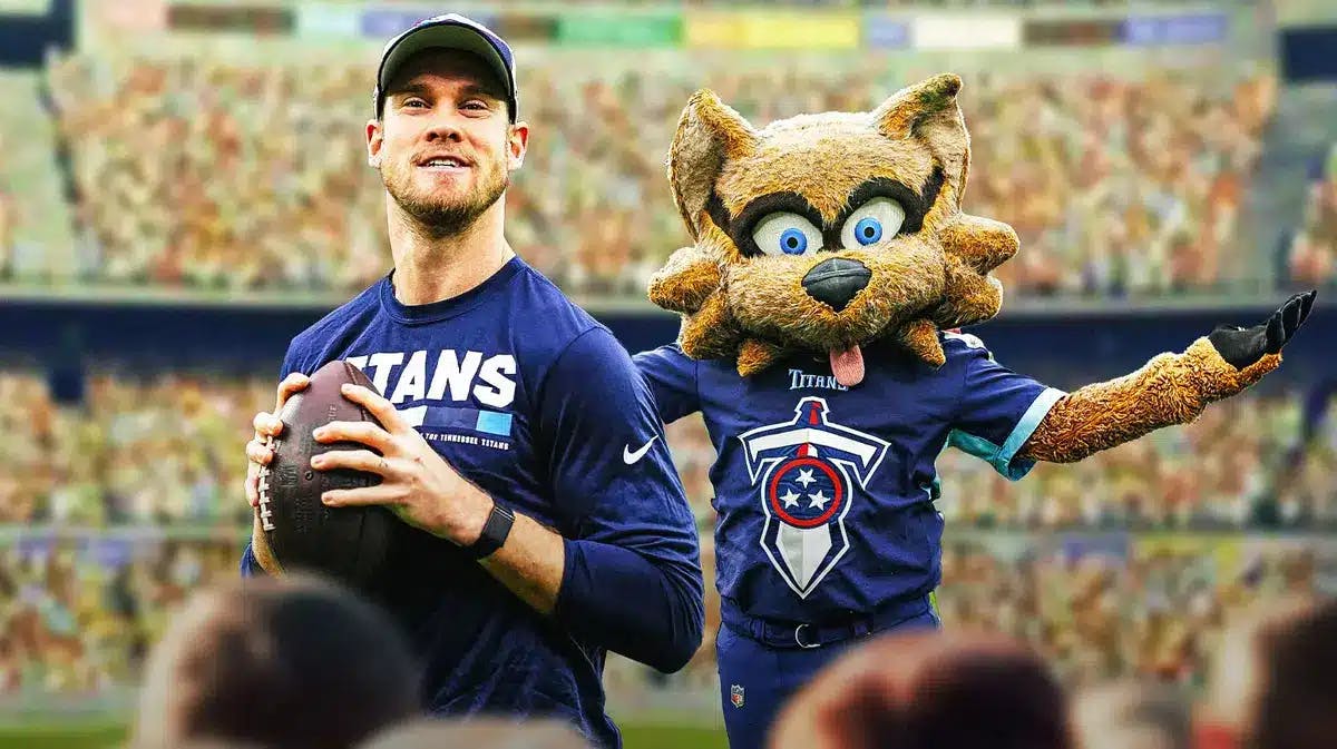 Ryan Tannehill (Titans) looking happy with Tennessee TITANS mascot in the background